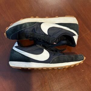 Women’s Black and White Nike Retro Sneakers